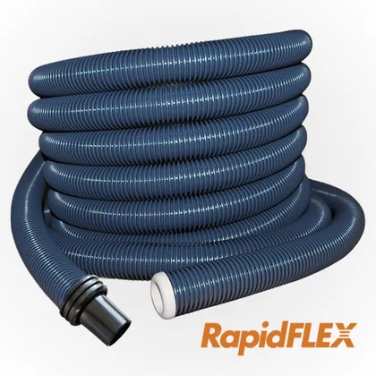 A dark blue ribbed central vacuum hose wound into a tall coil, with the fitting at one end.